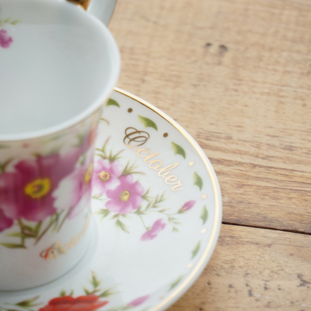 Tasse "Galice" du mois d'Octobre en porcelaine de Limoges fleuri et doré "So French" décor du Galion