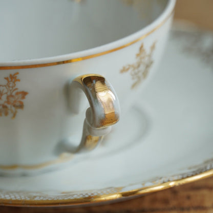 Tête-à-tête de tasses "Elielle" en porcelaine de luxe fleurie et dorée avec oiseaux