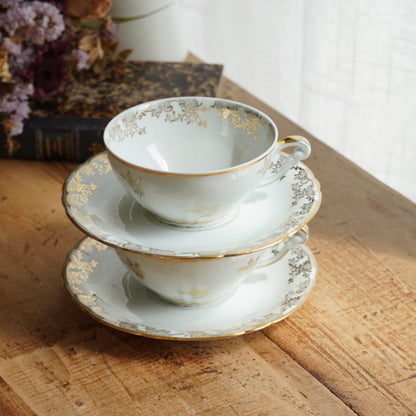 Tête-à-tête de tasses "Elielle" en porcelaine de luxe fleurie et dorée avec oiseaux