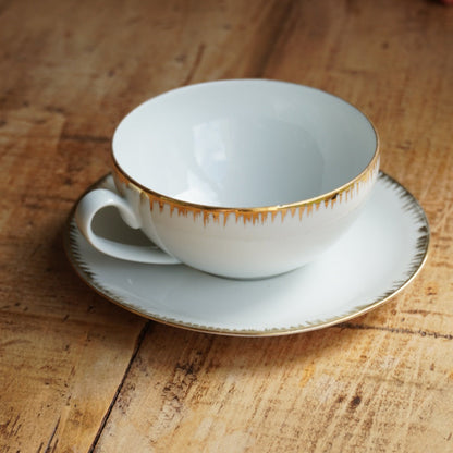 Grande tasse "Léonille" en porcelaine de Limoges blanche et dorée Singer