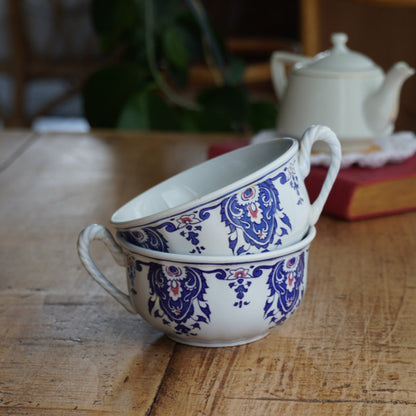 Tête-à-tête de tasses "Edilcie" en faïence de Salins-les-Bains aux motifs floraux bleus et rouges Salins modèle Rouen (lot de 2)