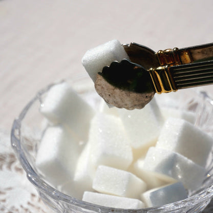 Pince à sucre "Mérélise" en métal doré et argenté