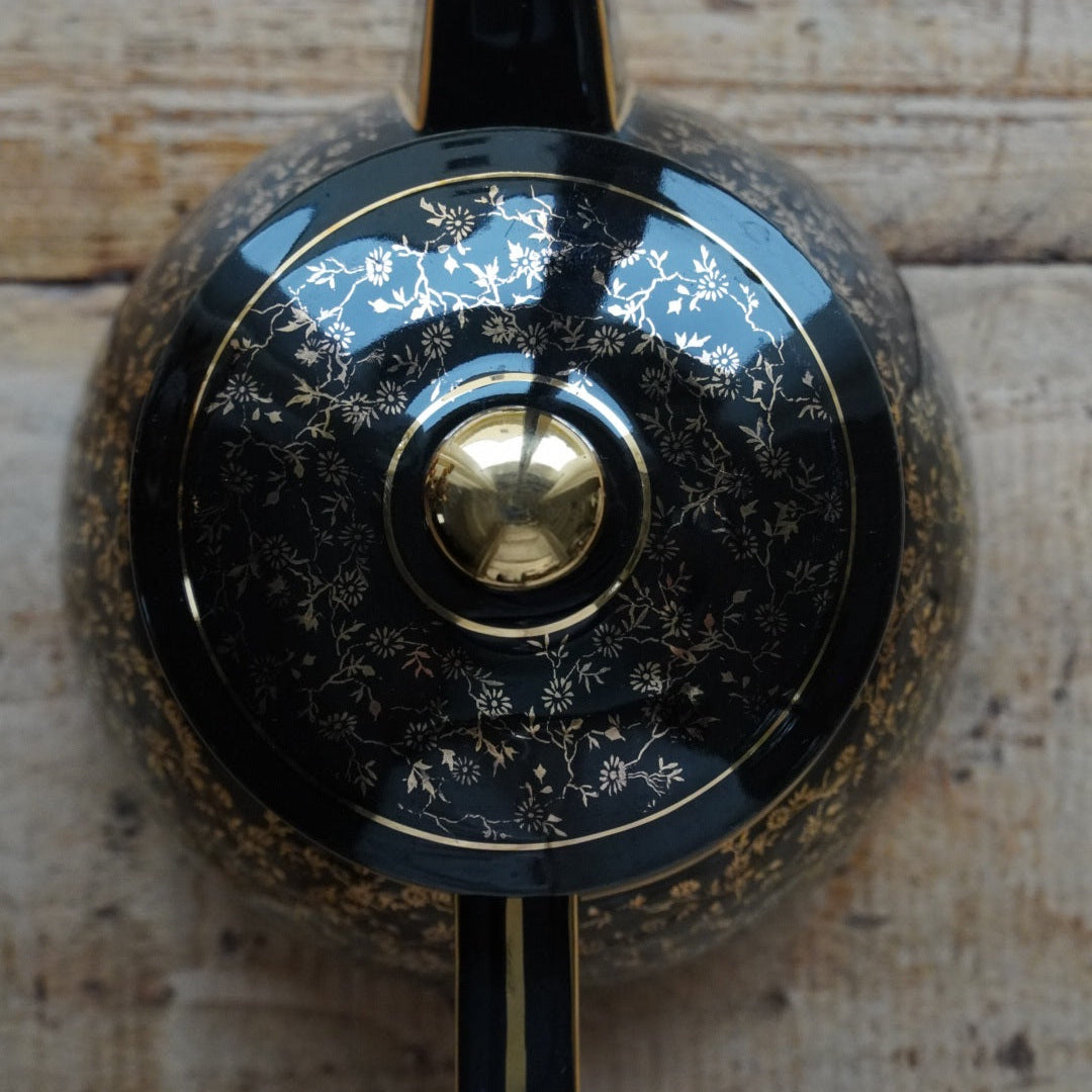 Théière ou cafetière "Théalie" en céramique française noire aux motifs fleuris dorés années 60/70