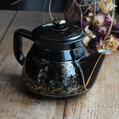 Théière ou cafetière "Théalie" en céramique française noire aux motifs fleuris dorés années 60/70