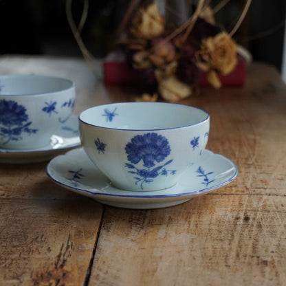 Tête-à-tête de tasses "Raymondet" en porcelaine de Limoges fleurie et dorée Raynaud