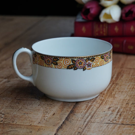 Grande tasse "Séphine" en porcelaine de Limoges couronnes motifs floraux orangés, jaunes et noirs